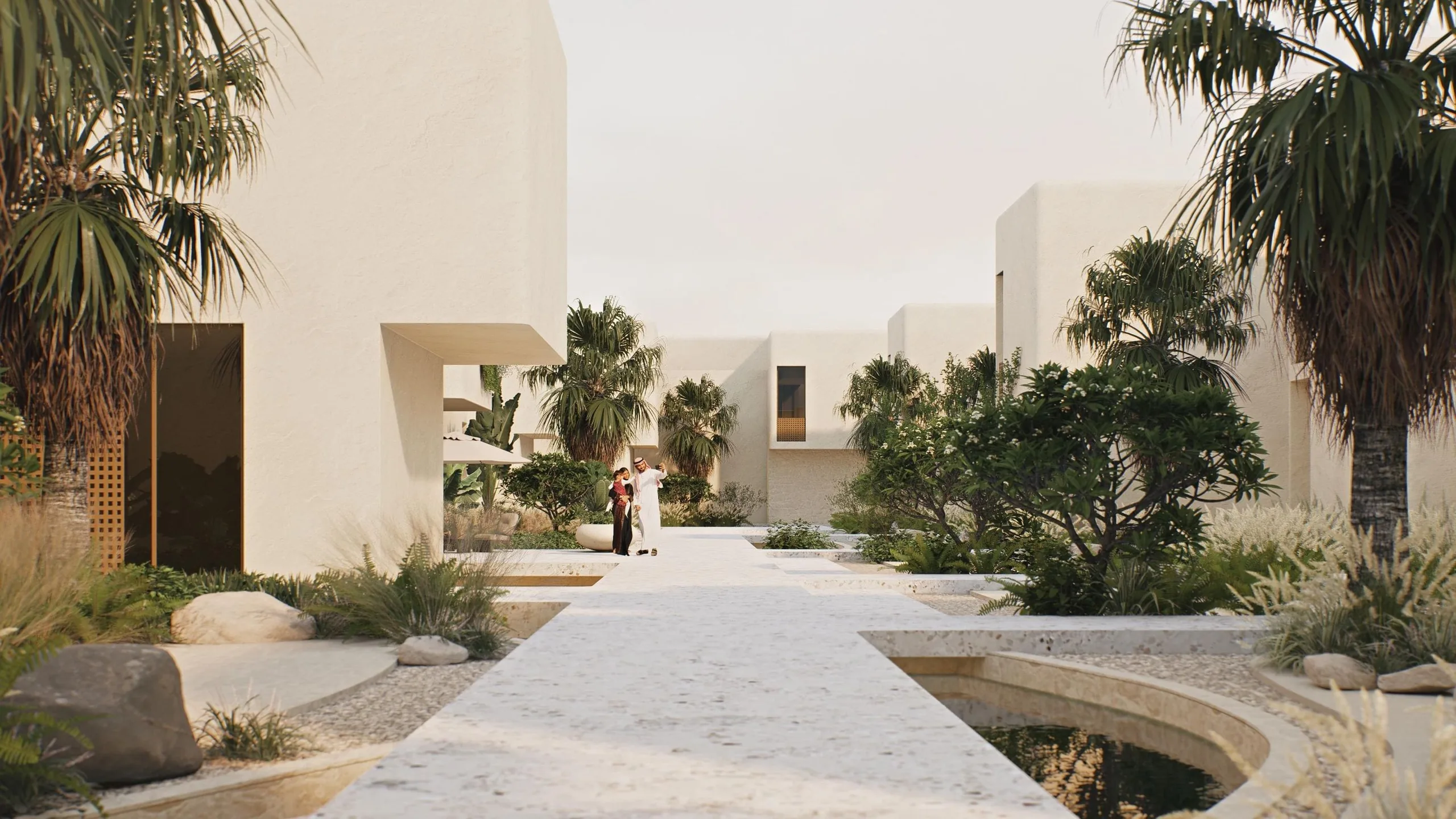 A couple walking through an Avalya courtyard