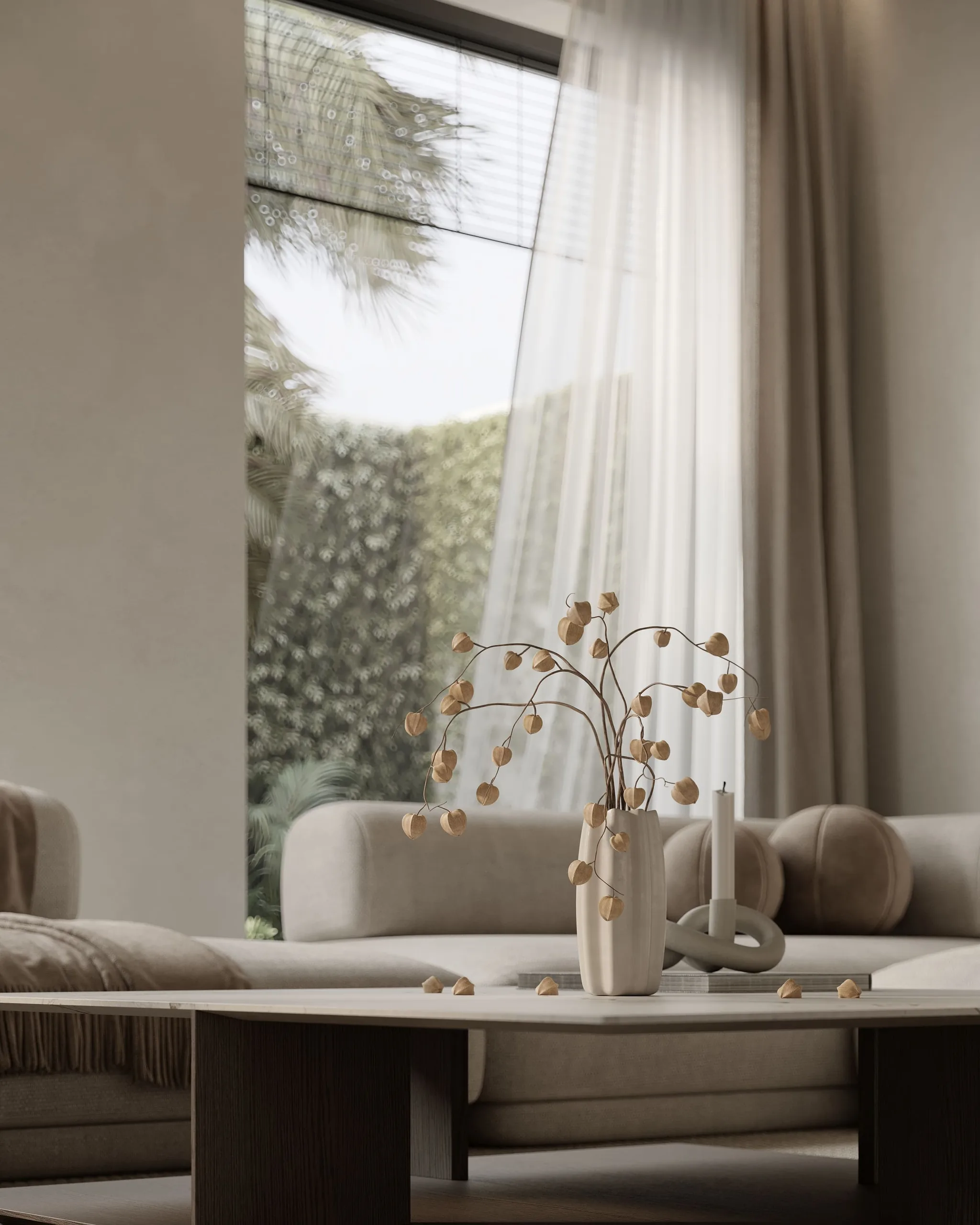A sofa by tall linen curtains